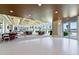 Versatile event space with tables, chairs, and large windows offering views of lush landscaping and the waterfront at 231 Riverside Dr # 2310, Holly Hill, FL 32117