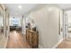 Inviting hallway with a view of the living room and a glimpse of the Primary bedroom at 231 Riverside Dr # 2310, Holly Hill, FL 32117