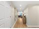 Hallway with wood floor leading to living room at 231 Riverside Dr # 2310, Holly Hill, FL 32117