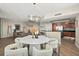 Open living space with modern decor, including a dining area, stylish furniture, and a functional kitchen at 231 Riverside Dr # 2310, Holly Hill, FL 32117