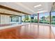 Bright yoga studio with mirrored wall, hardwood floors, and large windows showcasing the outdoor scenery at 231 Riverside Dr # 2310, Holly Hill, FL 32117