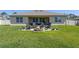 Backyard with fire pit and Adirondack chairs offering a relaxing outdoor space at 258 Sandoval Dr, Ormond Beach, FL 32174