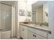 Bathroom vanity with granite countertop, white cabinets, and 'Relax and Unwind' decor at 258 Sandoval Dr, Ormond Beach, FL 32174