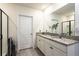 Bathroom featuring double sinks, granite countertops, and a glass-enclosed shower at 258 Sandoval Dr, Ormond Beach, FL 32174
