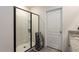 This bathroom features a modern, black-trimmed glass shower, and a granite countertop at 258 Sandoval Dr, Ormond Beach, FL 32174