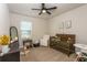 This Bedroom features a wooden crib, neutral walls, and a comfortable chair at 258 Sandoval Dr, Ormond Beach, FL 32174
