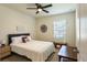 Bright bedroom with a ceiling fan, a comfortable bed and a window providing natural light at 258 Sandoval Dr, Ormond Beach, FL 32174