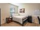 Bedroom with a twin bed, side table, printer, and a painting at 258 Sandoval Dr, Ormond Beach, FL 32174