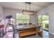 View of the dining room leading to the back patio through sliding glass doors at 258 Sandoval Dr, Ormond Beach, FL 32174