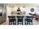 Beautiful kitchen with white cabinets, granite countertops, stainless appliances, and island seating at 258 Sandoval Dr, Ormond Beach, FL 32174