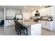 Elegant kitchen featuring white cabinets, granite countertops, and a spacious island with seating at 258 Sandoval Dr, Ormond Beach, FL 32174