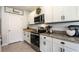 Close-up of the modern kitchen area with stainless steel oven and granite countertop at 258 Sandoval Dr, Ormond Beach, FL 32174