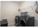 The laundry room features modern appliances and ample storage space at 258 Sandoval Dr, Ormond Beach, FL 32174