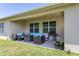 Covered patio with cozy seating, an outdoor grill, and string lights at 258 Sandoval Dr, Ormond Beach, FL 32174