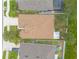 This aerial home view features manicured lawns, a fenced in yard, and a home with screened in lanai at 2672 Star Coral Ln, New Smyrna Beach, FL 32168