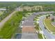 An aerial view of well-maintained houses with neat landscaping, showcasing the neighborhood layout at 2672 Star Coral Ln, New Smyrna Beach, FL 32168