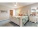 Inviting bedroom with coastal accents features a comfy bed and ample natural light at 2672 Star Coral Ln, New Smyrna Beach, FL 32168