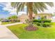 Exterior view of home displaying lush landscaping, a well-manicured lawn and charming curb appeal at 2672 Star Coral Ln, New Smyrna Beach, FL 32168