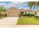 Charming single-Gathering home features a well-manicured lawn, mature landscaping, and a two-car garage at 2672 Star Coral Ln, New Smyrna Beach, FL 32168