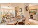 Eat-in kitchen features granite countertops, stainless steel appliances and adjacent dining area with bright natural light at 2672 Star Coral Ln, New Smyrna Beach, FL 32168