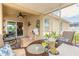 View of screened lanai, featuring ceiling fan, tile flooring, and sliding glass doors leading into the home at 2672 Star Coral Ln, New Smyrna Beach, FL 32168