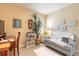 Cozy living room features a sofa, desk, and decorative shelving at 2672 Star Coral Ln, New Smyrna Beach, FL 32168