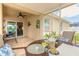 This bright and stylish patio features comfortable seating and access to the screened in lanai at 2672 Star Coral Ln, New Smyrna Beach, FL 32168