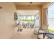 The spacious patio offers two separate seating areas with a bright screened-in porch beyond at 2672 Star Coral Ln, New Smyrna Beach, FL 32168