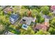 Aerial view of the property featuring the home, pool, and surrounding landscape at 28 Shadowcreek Way, Ormond Beach, FL 32174