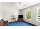 Bright bedroom featuring light walls, carpet, and large windows at 28 Shadowcreek Way, Ormond Beach, FL 32174