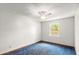 Cozy bedroom with light walls, blue carpet, and a ceiling fan at 28 Shadowcreek Way, Ormond Beach, FL 32174