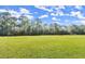 Wide green field perfect for sports, recreation, and community events under a partly cloudy blue sky at 28 Shadowcreek Way, Ormond Beach, FL 32174