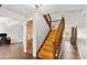 Foyer with wood floors, wooden staircase, and lots of natural light at 28 Shadowcreek Way, Ormond Beach, FL 32174