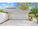 Large garage with a white door at 28 Shadowcreek Way, Ormond Beach, FL 32174