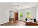 Well-lit home office boasts wood floors, large windows, and neutral walls at 28 Shadowcreek Way, Ormond Beach, FL 32174