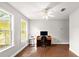 Well-lit home office boasts wood floors, large windows, and neutral walls at 28 Shadowcreek Way, Ormond Beach, FL 32174