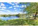 Picturesque pond with a bench surrounded by lush greenery, creating a serene setting for relaxation and reflection at 28 Shadowcreek Way, Ormond Beach, FL 32174