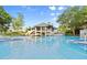 Resort style pool with inviting clubhouse creates a perfect place to relax and enjoy community amenities at 28 Shadowcreek Way, Ormond Beach, FL 32174