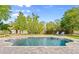 Backyard in-ground swimming pool with a brick paver surround at 28 Shadowcreek Way, Ormond Beach, FL 32174