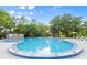 Large community swimming pool offers space for relaxation and recreation, complete with seating areas at 28 Shadowcreek Way, Ormond Beach, FL 32174