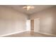 Empty room with beige flooring and neutral walls, great for staging as a home office or bedroom at 2811 S Asciano Ct, New Smyrna Beach, FL 32168