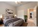 Comfortable bedroom with ceiling fan, tv, closet and a door leading to another room at 2811 S Asciano Ct, New Smyrna Beach, FL 32168