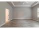 Spacious bedroom featuring wood-look tile flooring and recessed lighting at 2811 S Asciano Ct, New Smyrna Beach, FL 32168