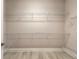 Spacious walk-in closet with built in metal shelving on all sides for optimal storage of personal items at 2811 S Asciano Ct, New Smyrna Beach, FL 32168