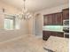 Charming dining area with a stylish chandelier and plenty of natural light at 2811 S Asciano Ct, New Smyrna Beach, FL 32168