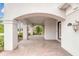 Covered entrance featuring brick flooring, elegant columns, and exterior views, welcoming visitors at 2811 S Asciano Ct, New Smyrna Beach, FL 32168