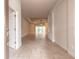 An open foyer with tiled floors leads into a spacious home, filled with natural light and neutral tones at 2811 S Asciano Ct, New Smyrna Beach, FL 32168