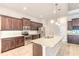 Modern kitchen with stainless appliances, granite counters, and plenty of cabinet space at 2811 S Asciano Ct, New Smyrna Beach, FL 32168