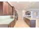 Bright kitchen with granite countertops, stainless steel appliances, and a large island at 2811 S Asciano Ct, New Smyrna Beach, FL 32168