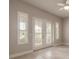 Bright living room featuring plantation shutters on windows and doors, letting in natural light at 2811 S Asciano Ct, New Smyrna Beach, FL 32168